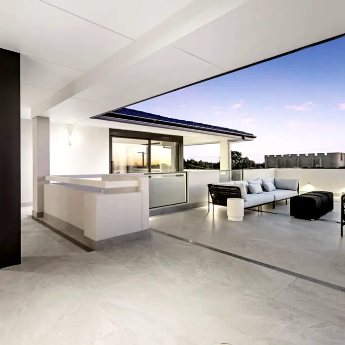 Ring pendant lighting over marble in a DesignFit commercial fitout