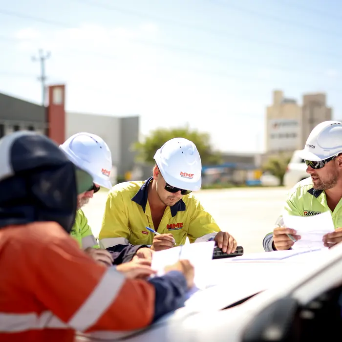 MME Underground Services crew reviewing plans on site
